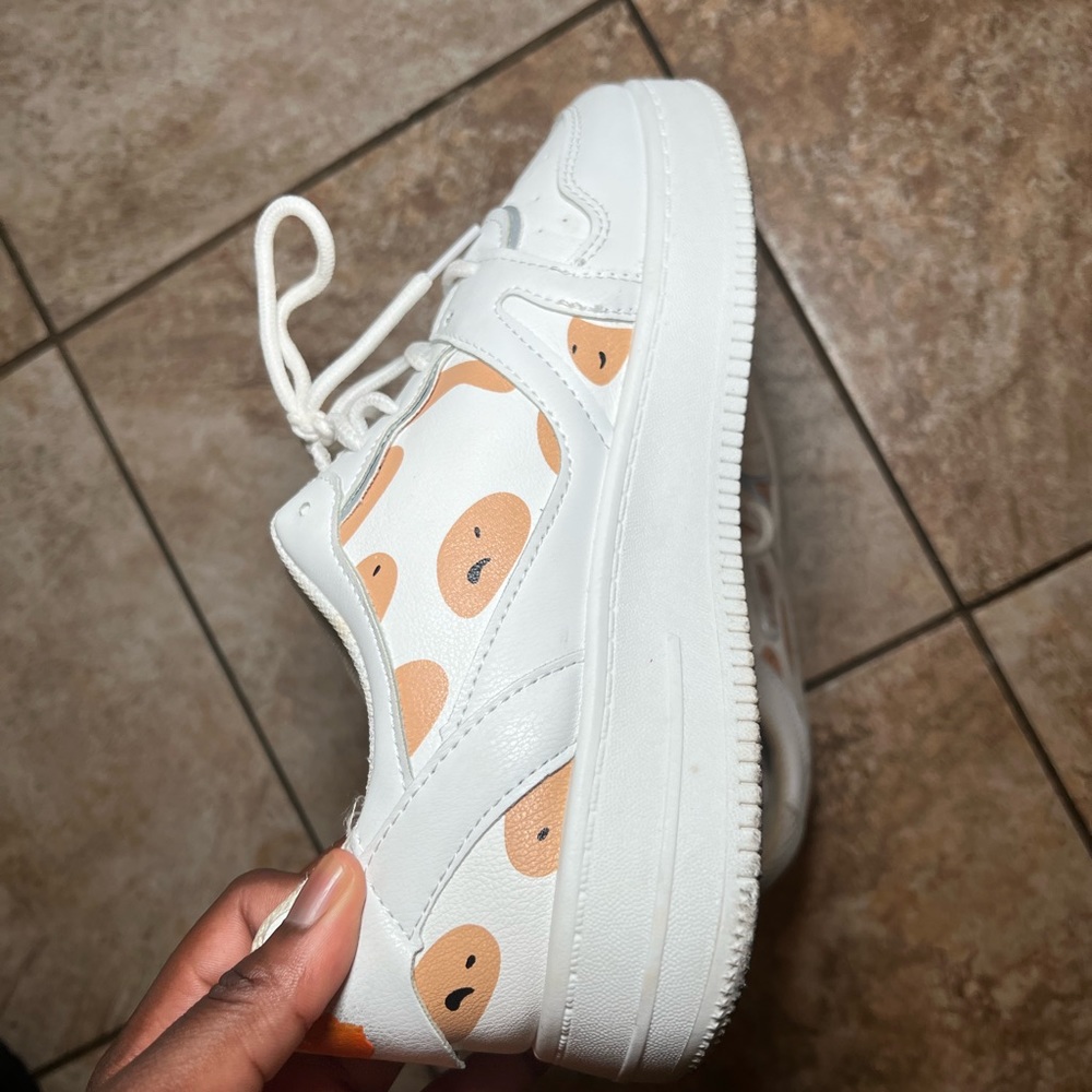White sneakers with orange design